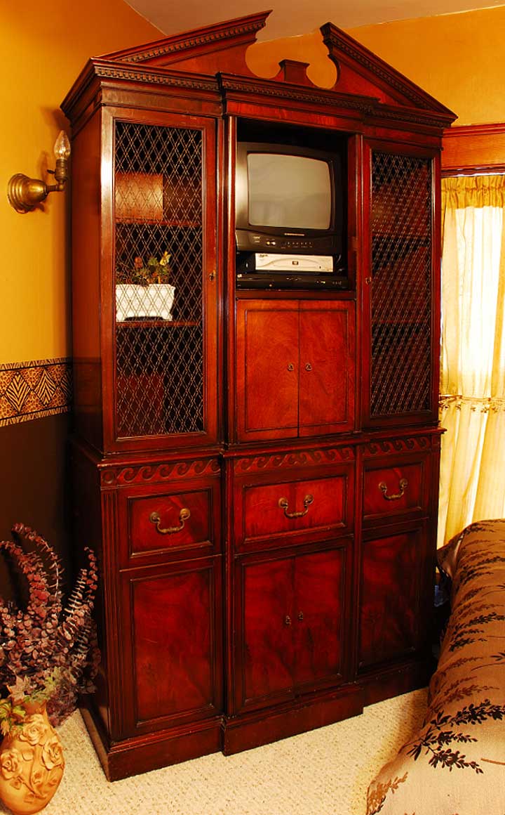 Our antique armoire in the Lindbergh Room reflects a moment trapped in time.